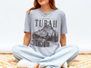 Turah Postcard T-Shirt | Shield of Sparrows