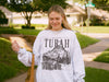 Turah Postcard Sweatshirt | Shield of Sparrows