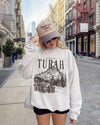 Turah Postcard Sweatshirt | Shield of Sparrows